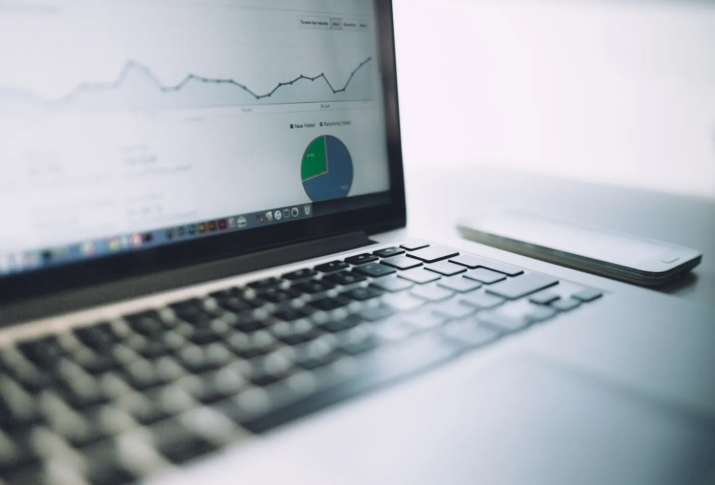 Laptop showing website analytics charts used for landing page conversion optimization