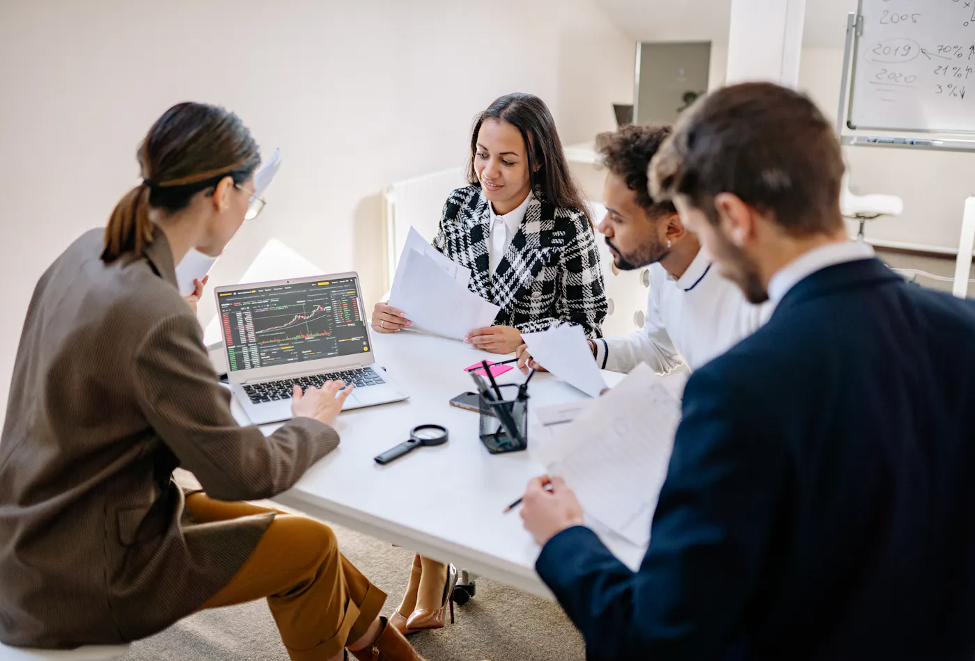 Business team reviewing analytics and campaign performance data together